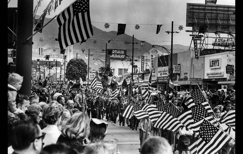 May 31, 1971: Girl Scouts, right, and Cub Scouts, center, march on Brand Blvd., during Memorial Day Parade in Glendale watched by 20,000 persons. This photo was published in the June 1, 1971 Los Angeles Times.